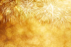 Defocused Gold fireworks and bokeh at New Year and copy space. Abstract background holiday.