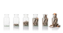 Glass jars with coins, savings concept