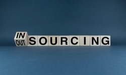 Insourcing or outsourcing. Cubes form words Insourcing or Outsourcing. Business concept