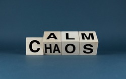 Calm or Chaos. Cubes form the words of choice Calm or Chaos. Concept of harmony and chaos in both life and business