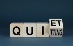 Quiet Quitting. Cubes form the word Quiet Quitting. Extensive Business Concept Quiet Quitting related to work and attitude to it