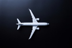 Jet airliner on black background. Plane crash and air incident. The tragedy, deaths, victims and injuries concept