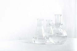 Science laboratory chemical beaker, Erlenmeyer and round flask lab glassware equipment. Research and development concept.