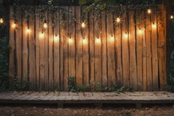 Evening Wooden Stage In The Garden With Lamps For Parties Or Wedding