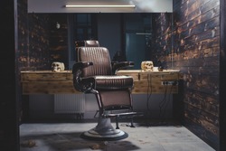 Stylish Vintage Barber Chair In Wooden Interior. Barbershop Theme