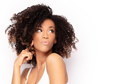 Young fashionable afro girl posing. White studio background.