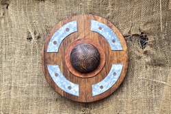 Round wooden shield.