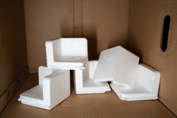 EPS foam in a cardboard box. Expanded Polystyrene foam is a product of styrene monomer.