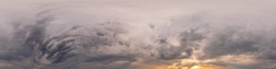 Overcast sky panorama on sunset with Cumulus clouds in Seamless spherical equirectangular format as full zenith for use in 3D graphics, game and aerial drone panoramas for sky replacement.