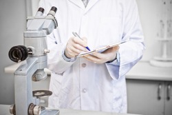 Scientist working in laboratory looking results