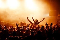 Crowd surfing during a musical performance