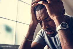 Black guy stressting and headache
