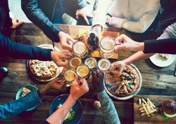 Friends toasting with craft beer