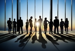 Silhouette of Business People Posing by Window