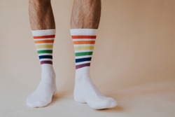 Mans leg in rainbow striped socks lgbt