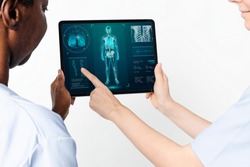 Doctors using tablet to diagnose medical technology