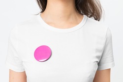 Pink empty badge pin on woman's t-shirt with design space