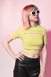 Cool teenage girl in neon yellow bandage crop top street apparel photoshoot