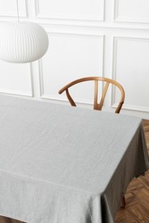 Minimal tablecloth on a table in a dining room