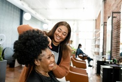 Hairstylist trimming the customer39;s hair at a beauty salon