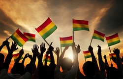 People Holding Red, Yellow and Green Striped Flag