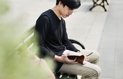 Asian man reading book relaxation