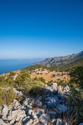 Lycian way hiking and trekking route, path, road in Mediterranean area with rocks, mountains. Mountain landscape image taken on the Lycian way trek in Turkey	

