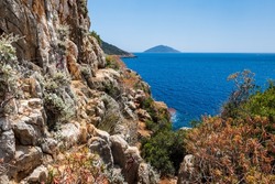 Lycian way hiking and trekking route with sea view in Turkish Mediterranean area with rocks, mountains. Mountain landscape image taken on the Lycian way hiking trail near Kas, Turkey.	