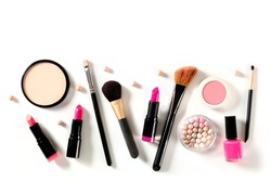 Professional makeup on a white background. Brushes, lipstick and other products, a flat lay with copy space