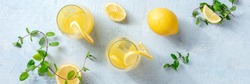 Lemonade panorama. Fresh lemon and mint homemade beverage, shot from the top. Healthy detox diet panoramic banner