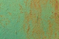 Old Green Door with Peeling Paint. Grunge Background 