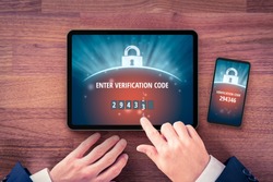 Two-factor authentication (2FA) and verification security concept. User with digital tablet and smart phone and two-factor authentication security process. Verify code on smart phone, flatlay design.