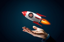 Bitcoin cryptocurrency rocket growth concept. Model of cartoon rocket representing fast growth and bitcoin coin instead of peephole.
