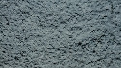 High detailed abstract fragment of gray drip wall background. Closed up of cement gray stone wallpaper. Old grungy stonewall urban texture