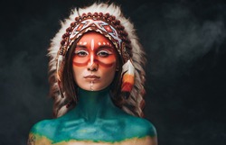 American indian woman with headdress and makeup