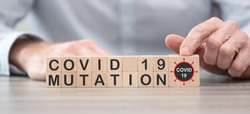 Concept of Covid-19 mutation on wooden cubes