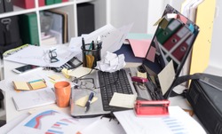 Messy and cluttered office desk