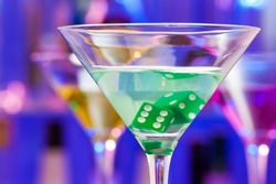 Close-up of cocktail glass with dice inside