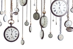 A number of pocket watches on chain isolated on white