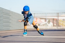 Boy riding on roller skates at outdoor  skate park