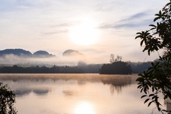 Ban Nong Thale the natural scenery of the sunshine in the morning (mountains, lakes, trees, fog) at Krabi, Thailand.