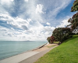 Ocean Path at Mairangi Bay Looking Towards Rangitoto Island in Auckland New Zealand on Bright Sunny Morning