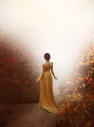 mysterious silhouette fantasy woman walking in autumn foggy forest, back rear view. Girl walks away. Women's long vintage historical dress. Collected hair high hairstyle. Art orange leaves trees trail