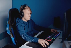 Young gamer playing online video games while streaming on social media - Youth people addicted to new technology game
