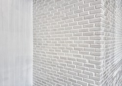 corner of white room with white brick wall 