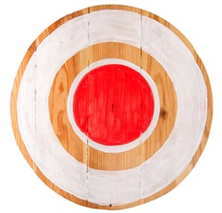 Vintage homemade wooden round target with red center on white background 