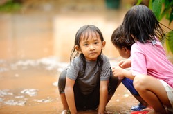 Flood, poverty kids playing
