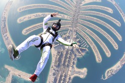 Rest tourism Jumeirah palm. Travel skydiver flying over the Islands. Beautiful views of Dubai city.Follow me.