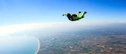 Skydiver free fall parachute man. Skydiving free fall man. Space games background sunset