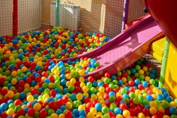 Plastic Slide With Colourful Balls For The Kid's Playground